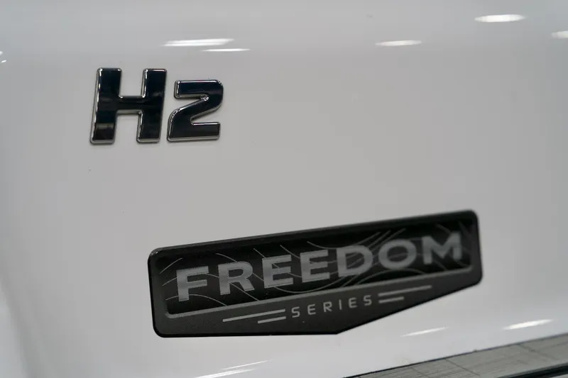 Slide: The Image of 2026 Four Winns H2 Freedom Series logo on white surface. - 11