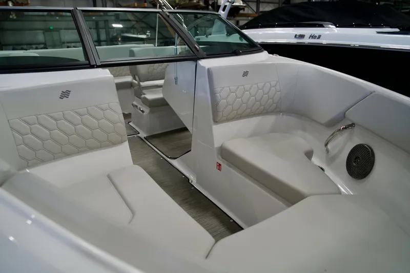 Slide: The Image of 2026 Four Winns H2 boat interior with white seating and modern design. - 18