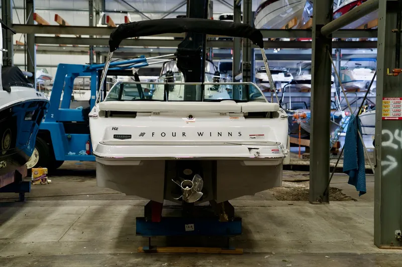 Slide: The Image of 2026 Four Winns H2 boat in storage facility, rear view. - 6