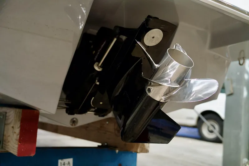 Slide: The Image of 2026 Four Winns H2 boat propeller and stern detail in a workshop setting. - 9