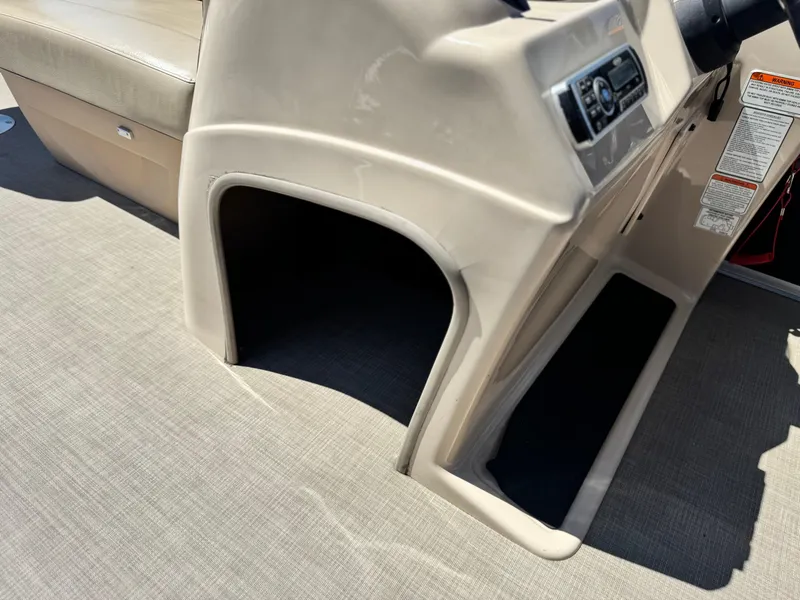 Slide: The Image of 2019 Sun Tracker Fishin' Barge 20 DLX interior console and seating area. - 21