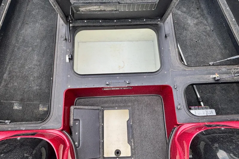 Slide: The Image of 2007 Skeeter ZX 200 boat interior with storage compartments and red accents. - 6