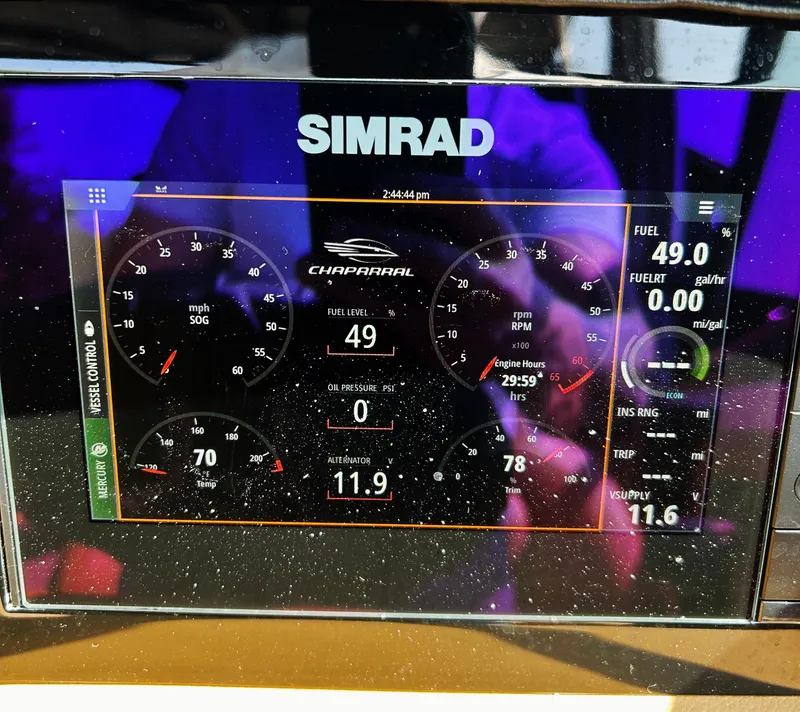 Slide: The Image of Simrad display on 2022 Chaparral 307 SSX showing speed, fuel, and engine data. - 9