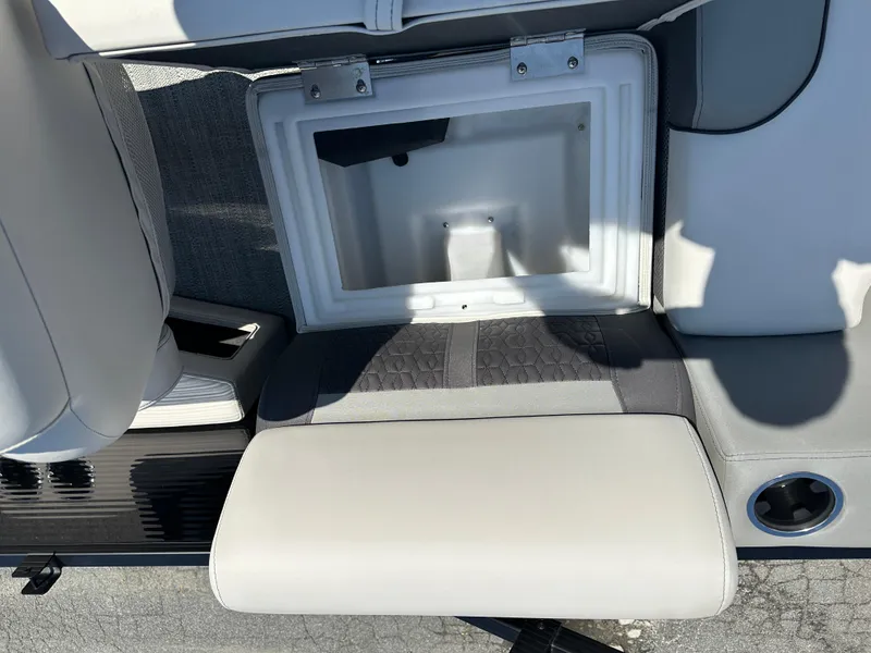 Slide: The Image of Open storage compartment on 2022 Godfrey SWEETWATER 2286 SFL boat seat. - 10