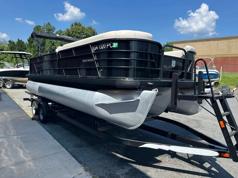 Slide: The Image of 2022 Godfrey SWEETWATER 2286 SFL pontoon boat on trailer, sunny day. - 3