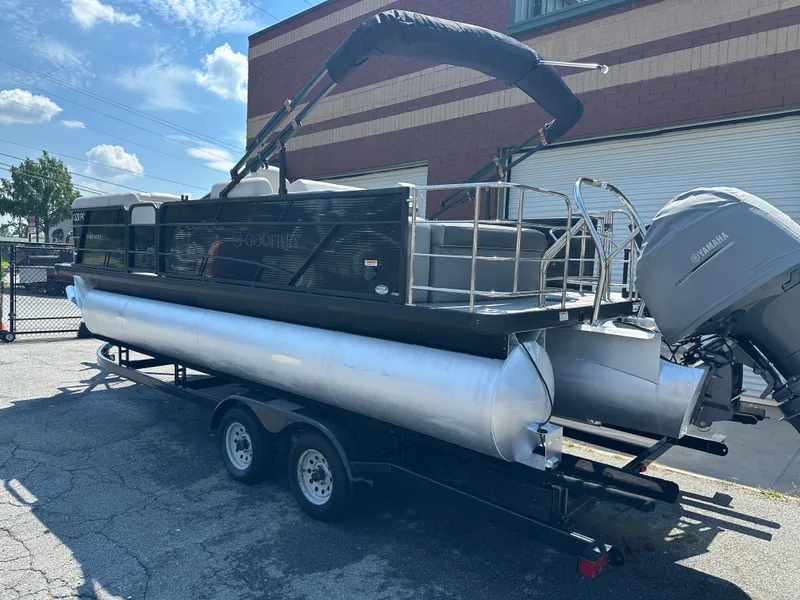 Slide: The Image of 2022 Godfrey SWEETWATER 2286 SFL pontoon boat on trailer, parked outdoors. - 5