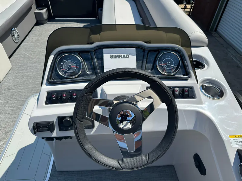 Slide: The Image of Steering console of 2022 Godfrey SWEETWATER 2286 SFL boat with Simrad display. - 8