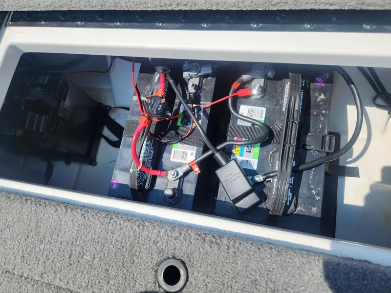Slide: The Image of Batteries in a 2022 Nitro Z17 boat compartment with wiring connections. - 13