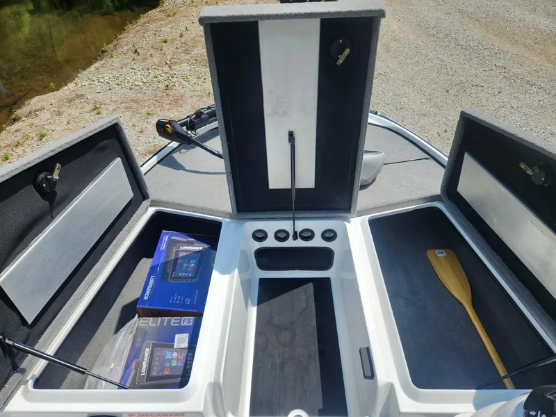 Slide: The Image of 2022 Nitro Z17 boat storage compartments with Lowrance Elite FS boxes and a paddle. - 16