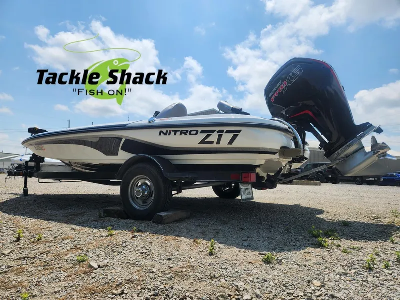 Slide: The Image of 2022 Nitro Z17 boat with Mercury engine, displayed at Tackle Shack under a clear sky. - 2
