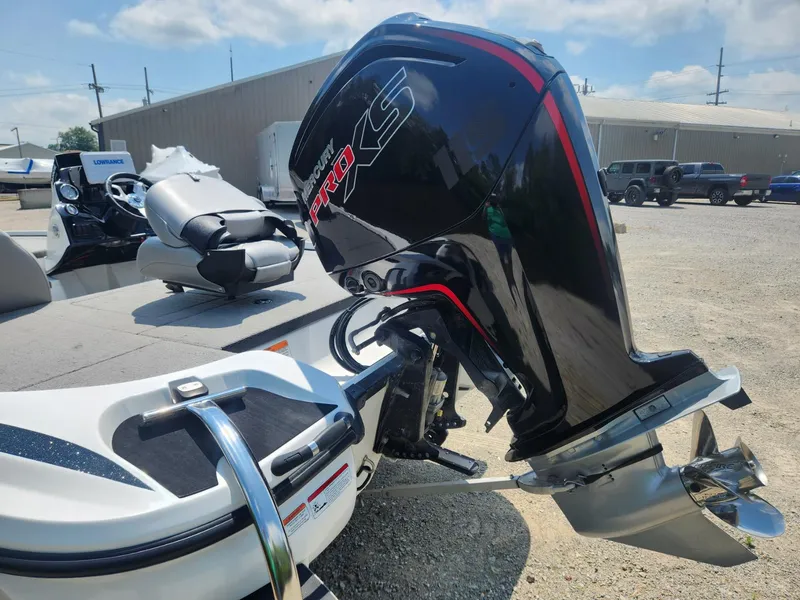 Slide: The Image of 2022 Nitro Z17 boat with Mercury Pro XS outboard motor in a sunny outdoor setting. - 4