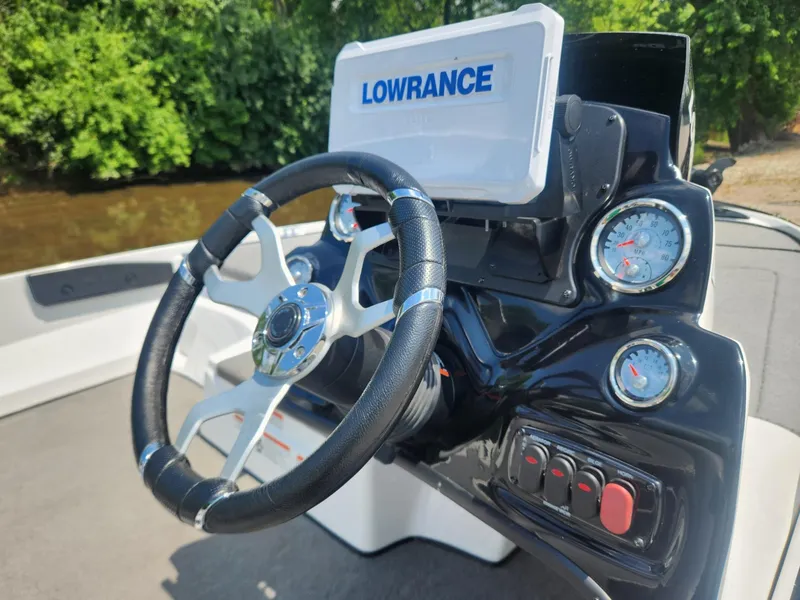 Slide: The Image of Steering wheel and dashboard of 2022 Nitro Z17 boat with Lowrance display. - 8