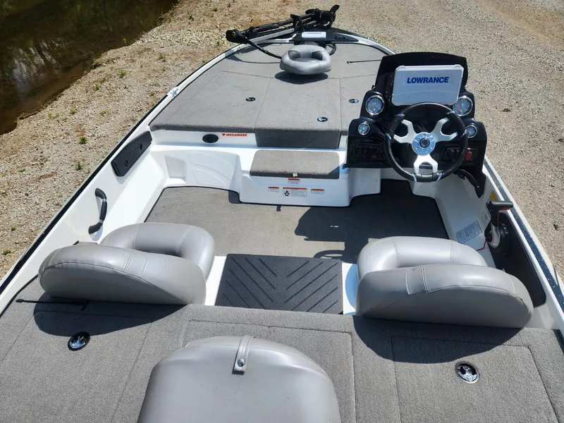 Slide: The Image of 2022 Nitro Z17 boat interior with steering wheel and seating, featuring Lowrance electronics. - 9