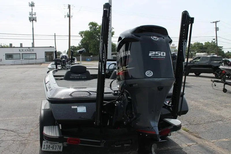 Slide: The Image of 2018 Skeeter ZX250 boat with Yamaha 250 engine in a parking lot. - 5