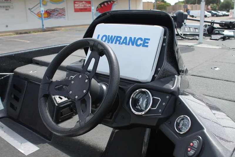 Slide: The Image of 2018 Skeeter ZX250 boat dashboard with steering wheel and Lowrance display. - 8