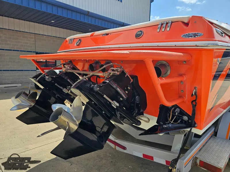 Slide: The Image of 2007 Baja 35 Outlaw boat with dual propellers and vibrant orange exterior. - 35