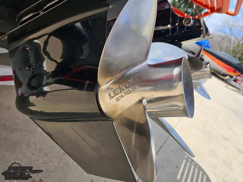 Slide: The Image of Close-up of a 2007 Baja 35 Outlaw boat propeller with Lexor branding. - 37