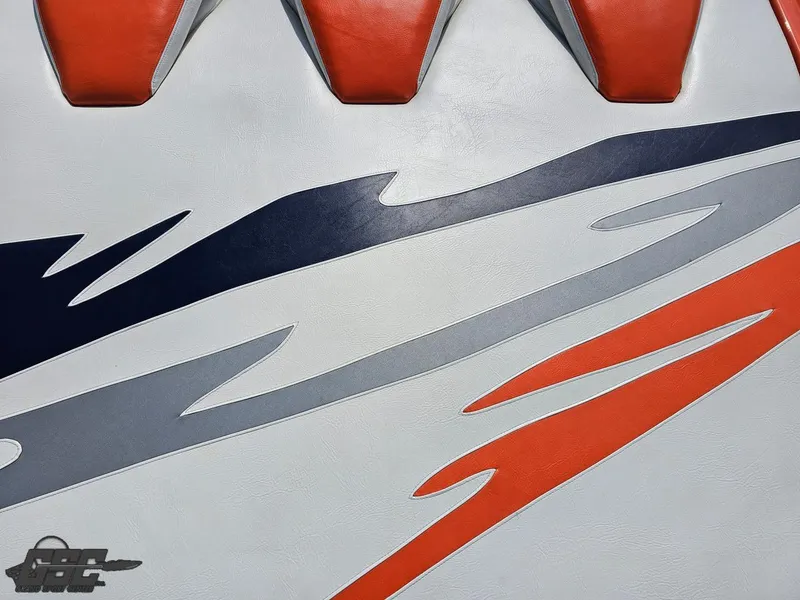 Slide: The Image of 2007 Baja 35 Outlaw boat interior with vibrant red, blue, and gray design accents. - 47