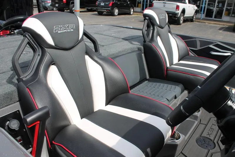 Slide: The Image of 2026 Skeeter FXR 21 FLEX boat seats with black, white, and red accents. - 2