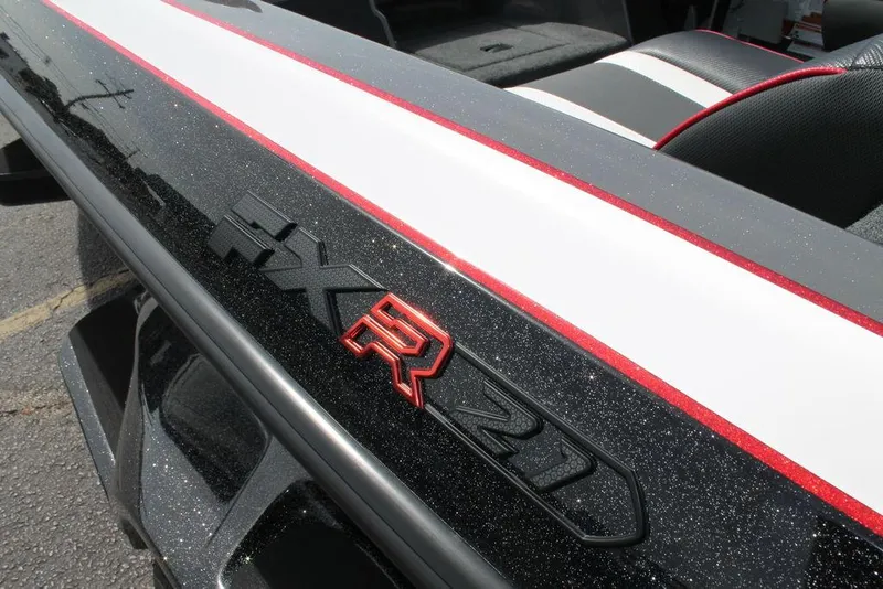 Slide: The Image of 2026 Skeeter FXR 21 FLEX boat detail with sleek black and red design. - 8