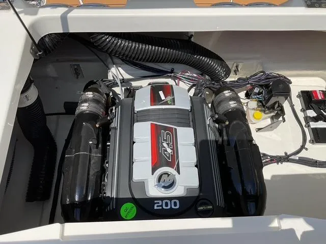 Slide: The Image of Engine compartment of a 2025 Bayliner V20i boat, featuring a 200 horsepower engine. - 16