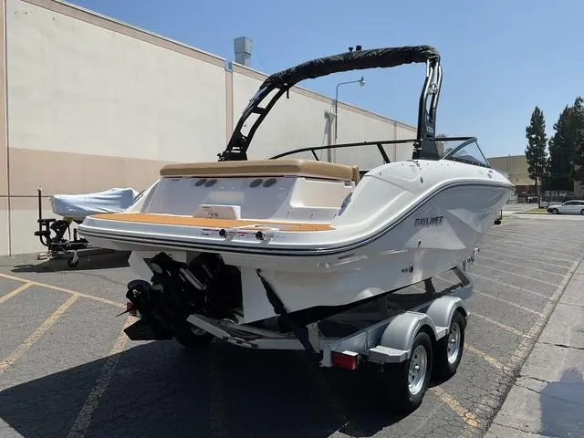 Slide: The Image of 2025 Bayliner V20i boat on trailer in parking lot, rear view. - 6