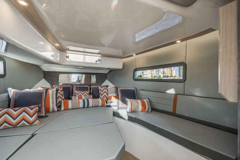 Slide: The Image of Luxurious interior of 2025 Hanover 377 Outboard boat with modern seating and colorful cushions. - 14
