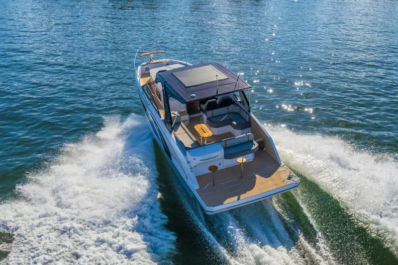 Slide: The Image of 2025 Hanover 377 Outboard boat cruising on open water, showcasing sleek design and performance. - 3
