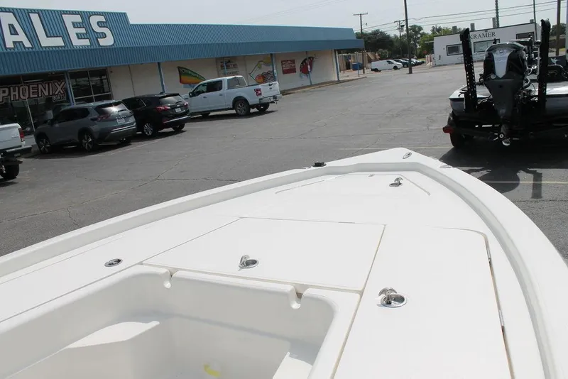 Slide: The Image of 2026 Skeeter SX221 boat displayed at dealership parking lot. - 9