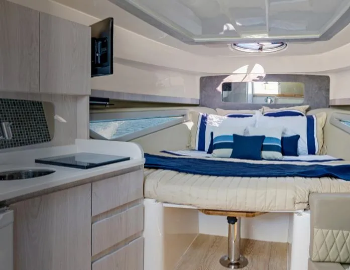 Slide: The Image of Luxurious interior of 2025 Hanover 375 Inboard boat with cozy bed and modern amenities. - 16