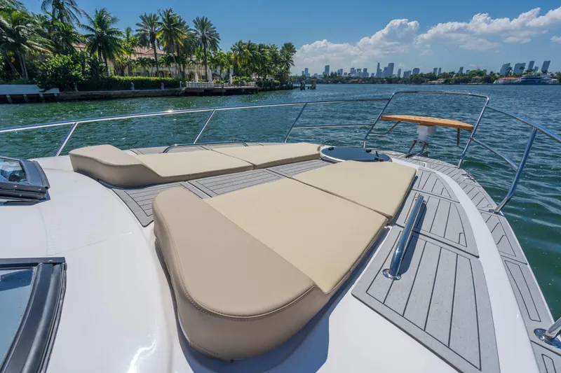 Slide: The Image of 2025 Hanover 375 Outboard yacht with sun loungers on deck, scenic waterfront view. - 7