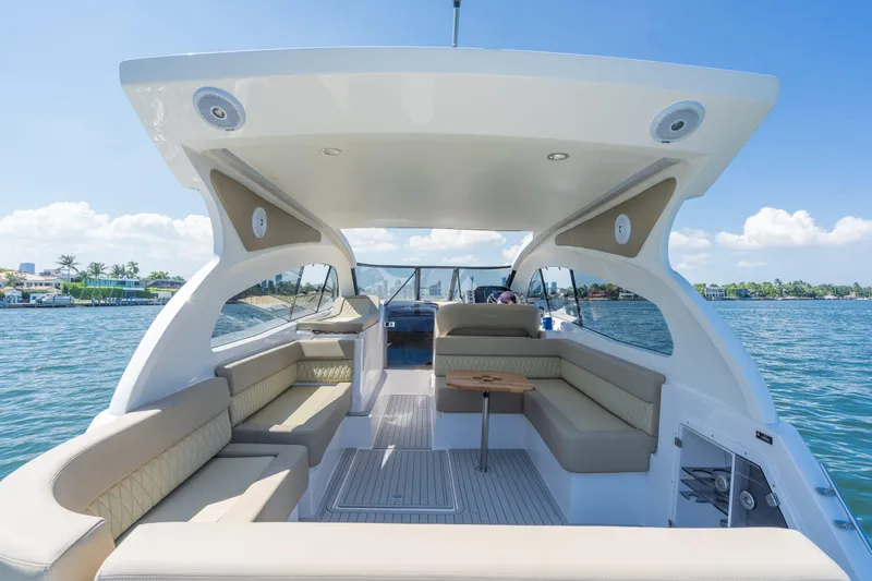 Slide: The Image of Luxurious 2025 Hanover 375 Outboard boat interior with spacious seating and scenic water view. - 8