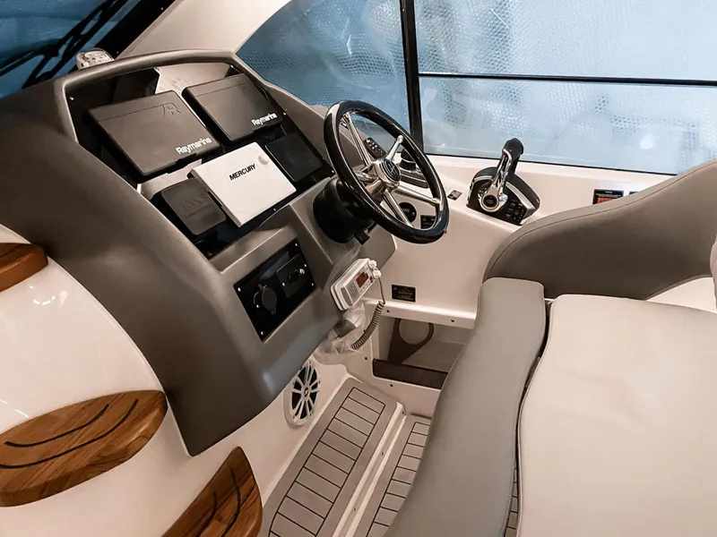 Slide: The Image of Interior view of 2025 Hanover 375 Outboard boat cockpit with modern controls and steering. - 10