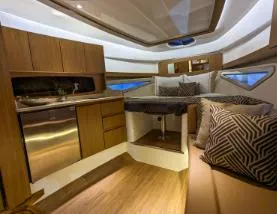 Slide: The Image of Luxurious interior of 2025 Hanover 375 Outboard boat with modern amenities and stylish design. - 13