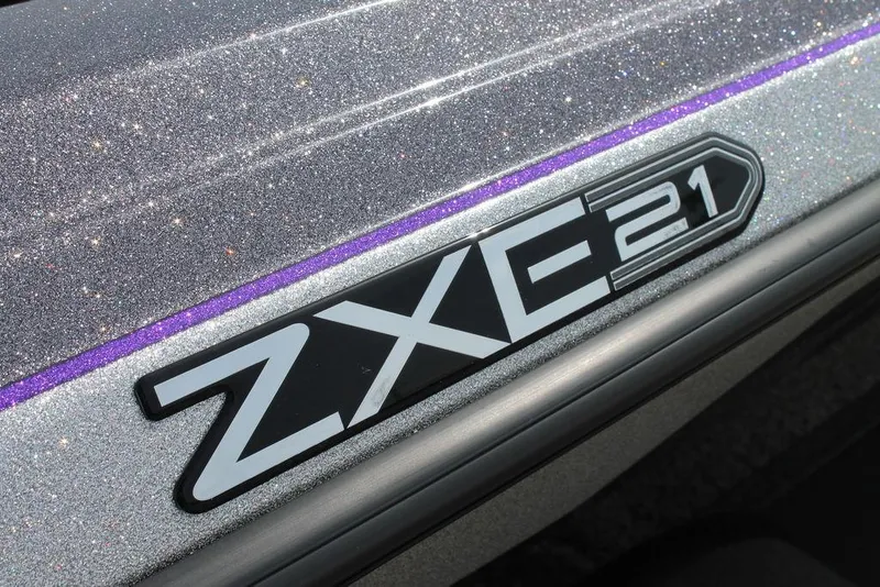 Slide: The Image of 2026 Skeeter ZXE21 logo on glittery surface with purple accent. - 2