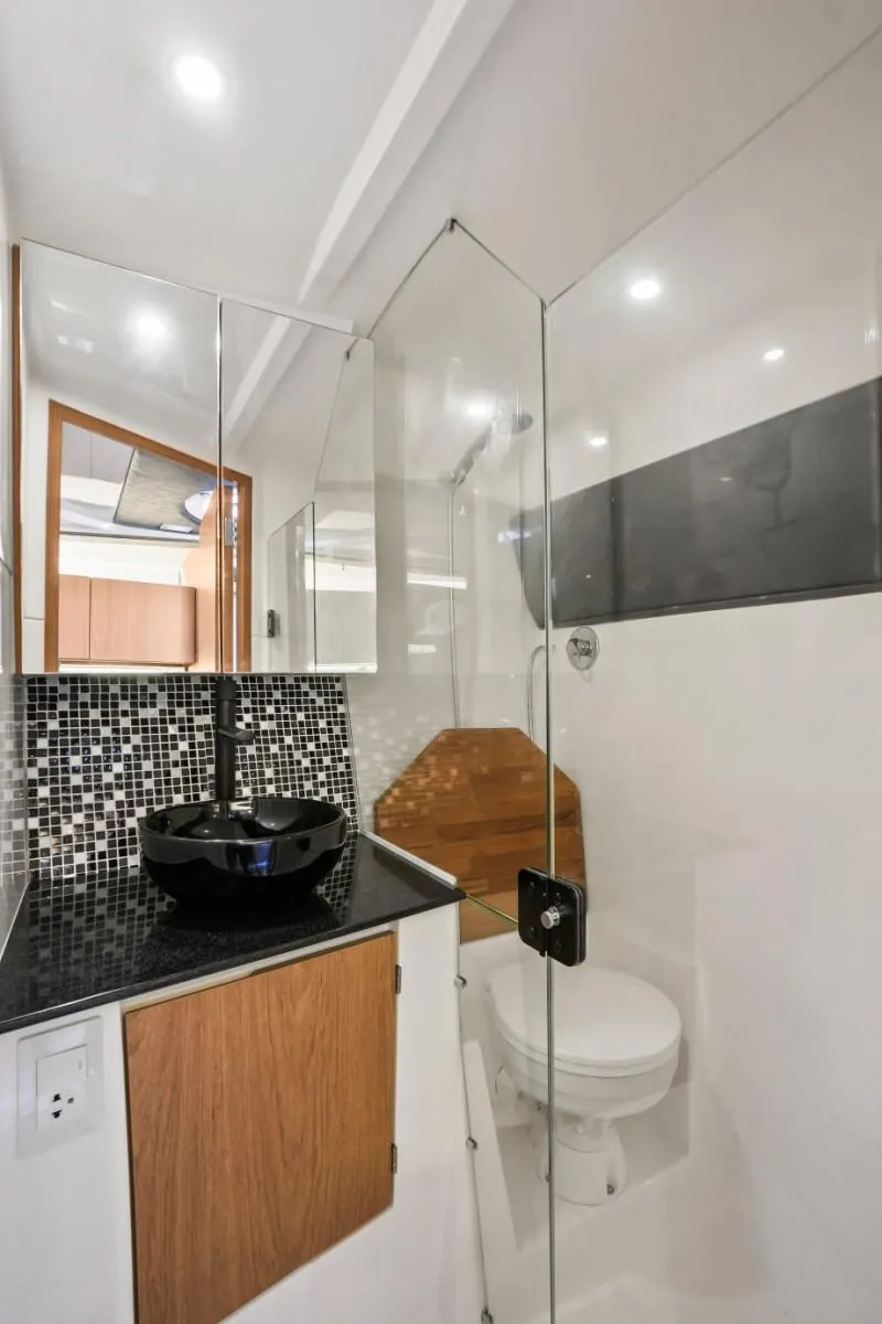 Slide: The Image of Modern bathroom in 2025 Hanover 355 Outboard boat with glass shower and stylish sink. - 18