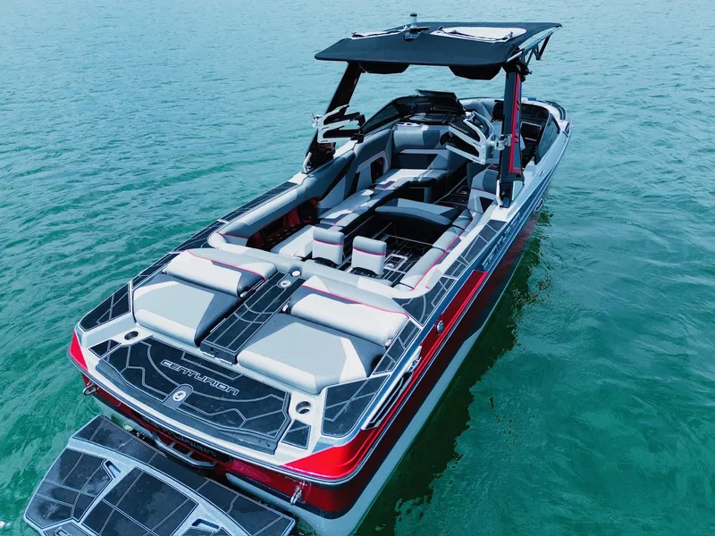 Slide: The Image of 2021 Centurion Ri265 boat on water, featuring sleek design and spacious seating. - 11