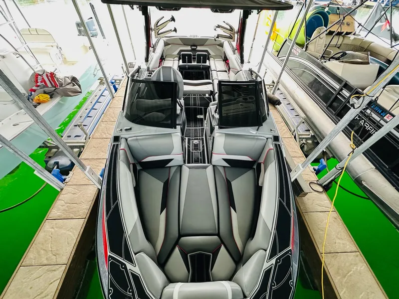 Slide: The Image of 2021 Centurion Ri265 boat interior with sleek seating and modern design. - 14