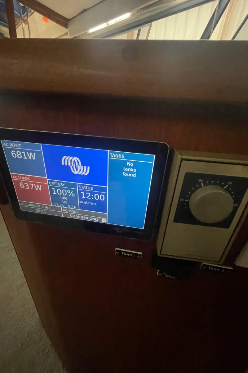 Slide: The Image of Control panel of a 1988 Bayliner 4588 displaying power and battery status. - 11