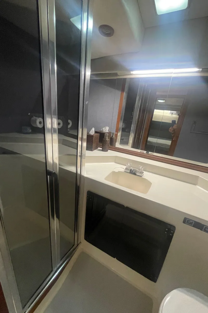 Slide: The Image of Bathroom interior of 1988 Bayliner 4588 yacht with shower and sink. - 19