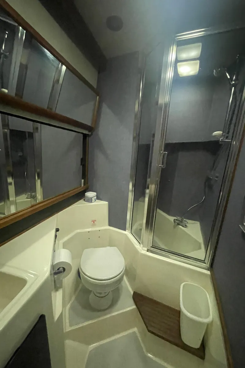 Slide: The Image of Bathroom interior of 1988 Bayliner 4588 yacht with shower and toilet. - 24