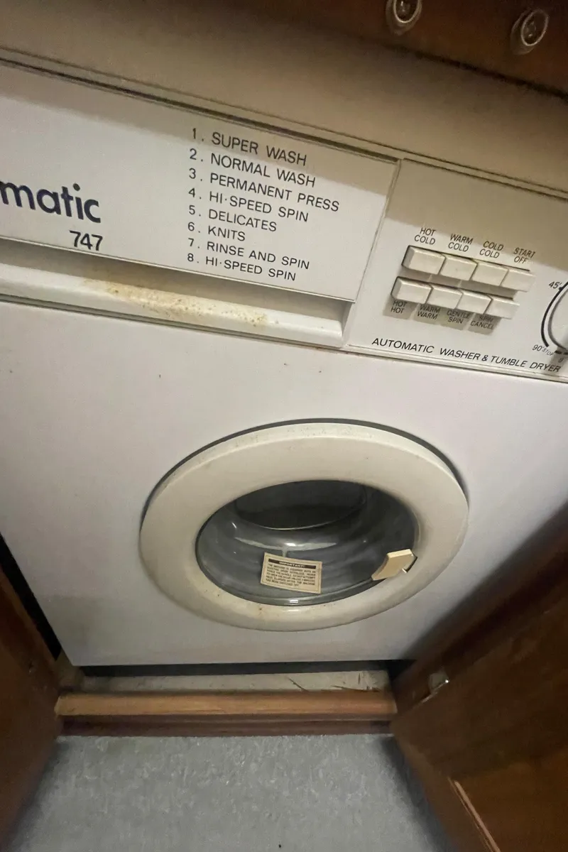 Slide: The Image of Automatic washer and dryer with multiple wash settings on a Bayliner 4588 yacht. - 25