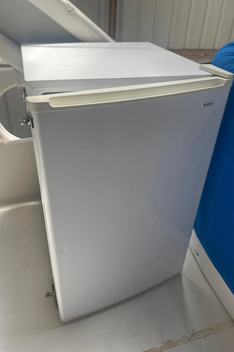 Slide: The Image of White mini fridge on 1988 Bayliner 4588 boat deck. - 31