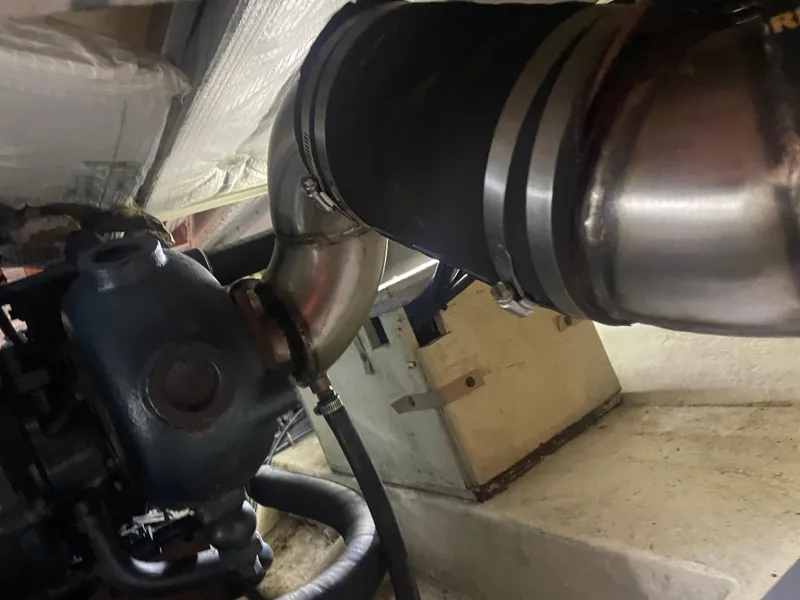 Slide: The Image of Engine compartment of a 1988 Bayliner 4588, showing exhaust system components. - 35