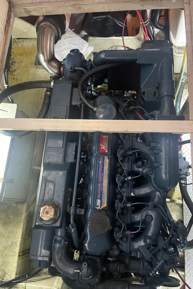 Slide: The Image of Engine of a 1988 Bayliner 4588 yacht, showcasing intricate mechanical components. - 38