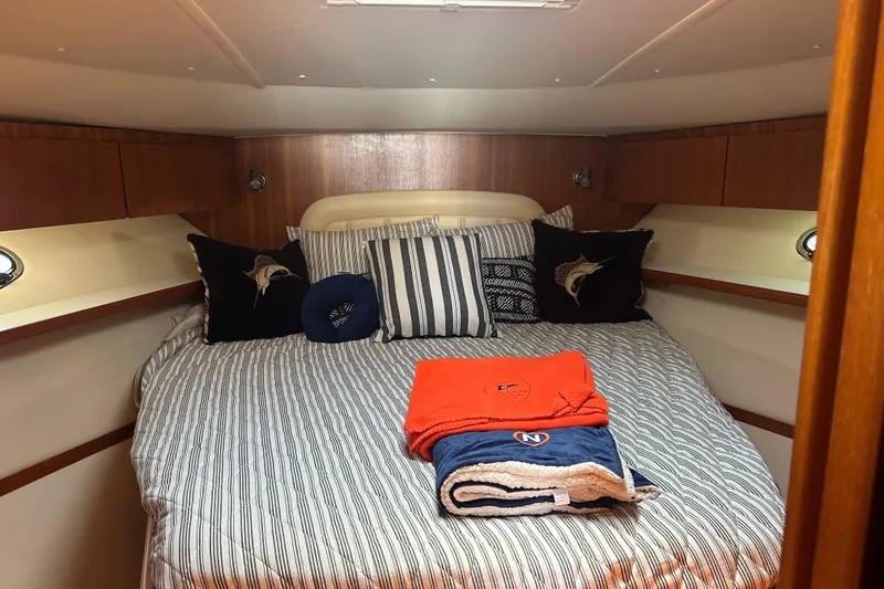 Slide: The Image of Luxurious cabin interior of 2005 Tiara Yachts 3800 Open with cozy bedding. - 10