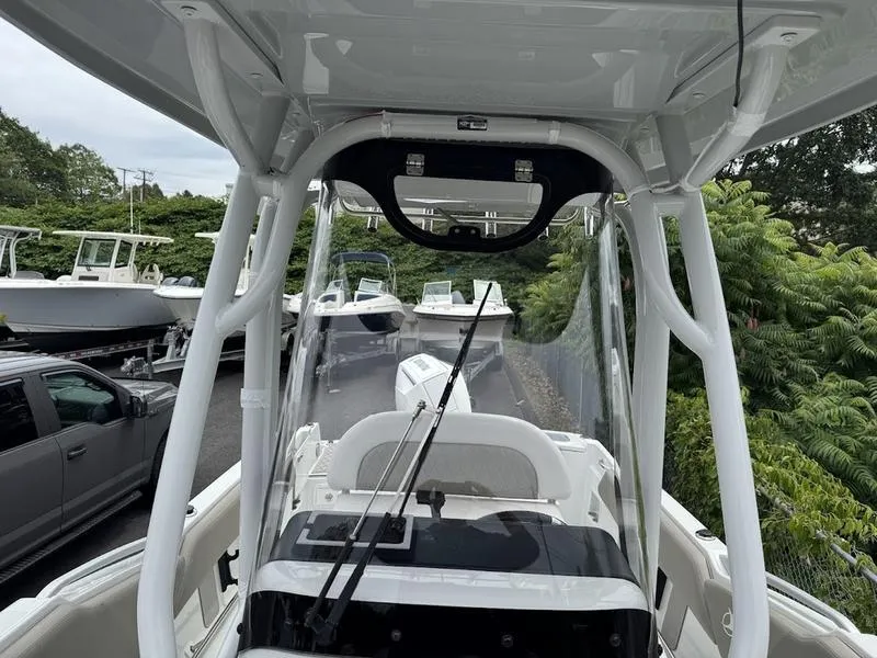 Slide: The Image of 2024 Finseeker 230 CC boat interior with clear canopy and fishing rod holders. - 11