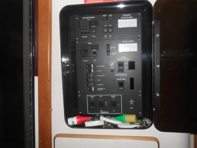 Slide: The Image of Electrical control panel on a 1990 Sea Ray 350 Sundancer Coupe boat. - 13