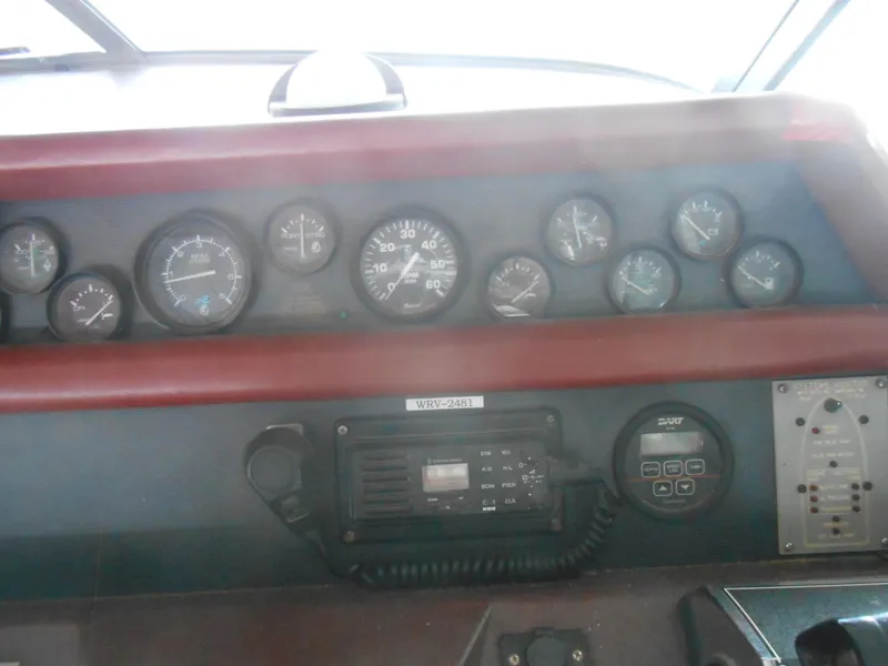 Slide: The Image of Control panel of a 1990 Sea Ray 350 Sundancer Coupe boat. - 19