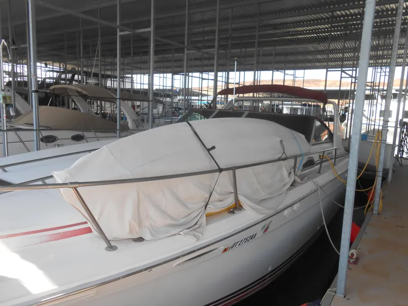Slide: The Image of 1990 Sea Ray 350 Sundancer Coupe docked in covered marina. - 21